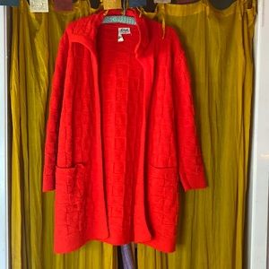 Vintage red wool cardigan from milrank. 3/4 sleeves. Two pockets.